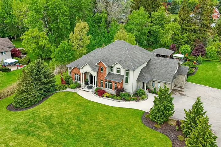 Estate home and landscaped grounds from the air