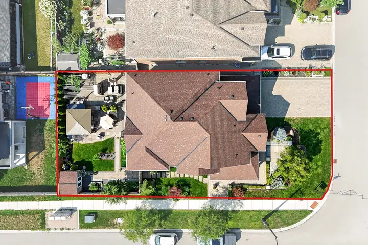 Top-down aerial of a home with the lot outlined