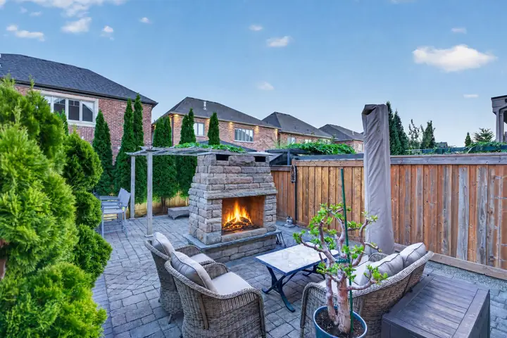 Patio with a stone fireplace