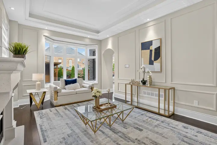 Living room with gold accents and wall panelling
