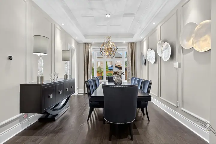 Formal dining room with a statement chandelier