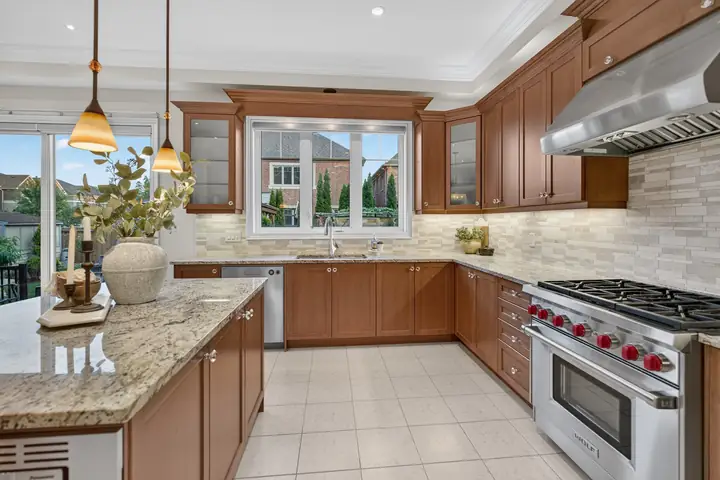 Kitchen with wood cabinets and a gas range