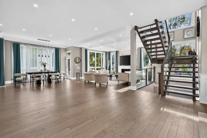 Open main floor with a floating staircase