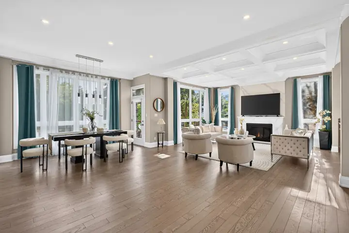 Open living and dining room with a coffered ceiling