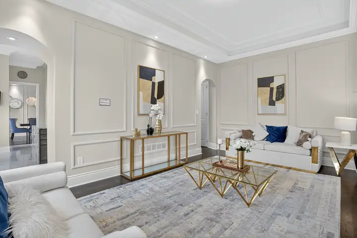 Panelled living room with a glass coffee table