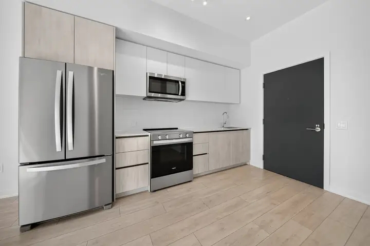 Condo kitchen with stainless appliances