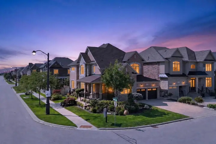 Street of detached homes at twilight